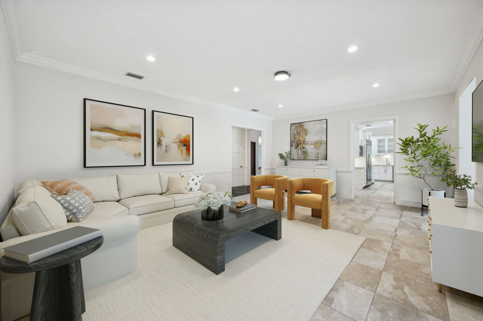 Living room with crown molding and open flow to kitchen